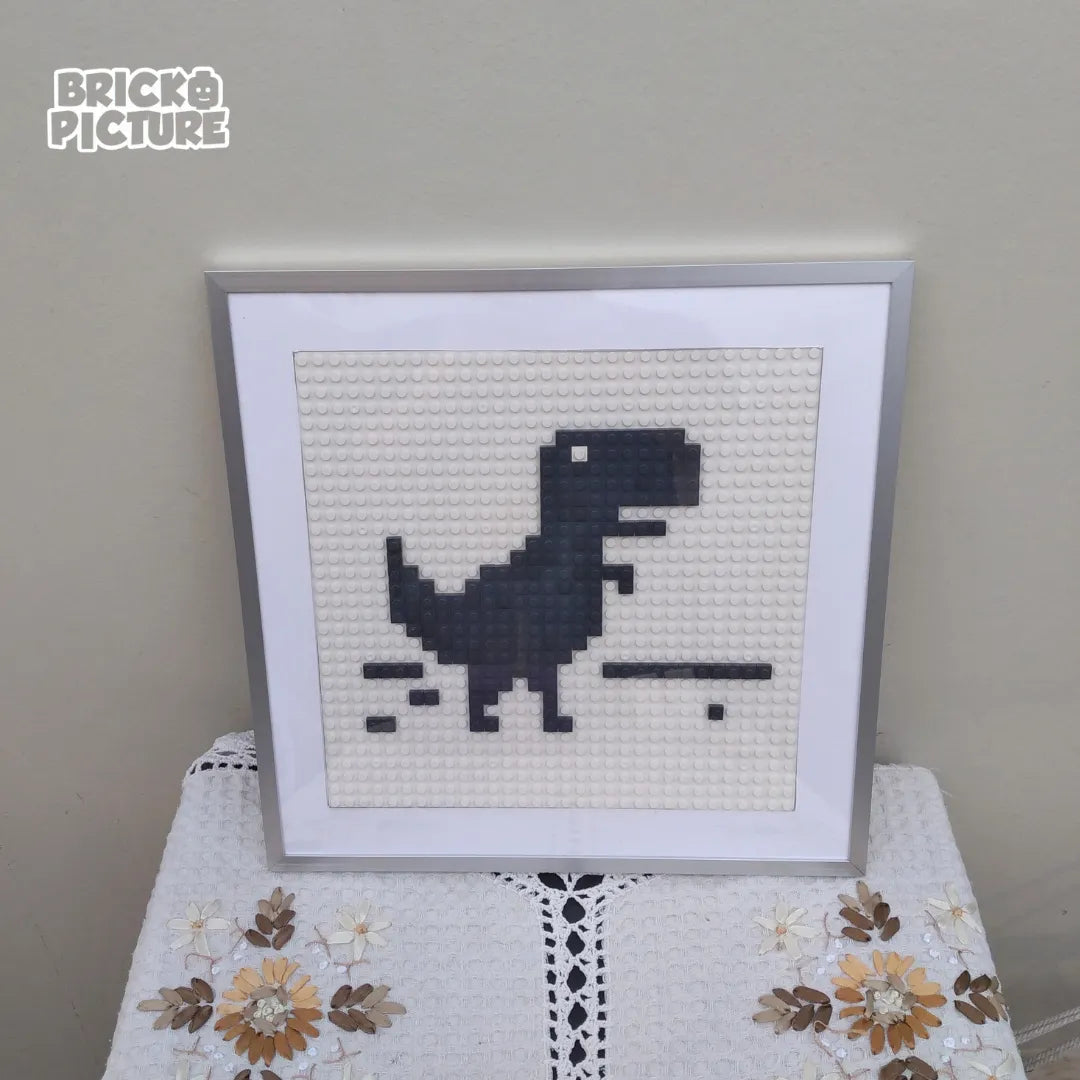 Cuadro Pixel Art Dinosaurio de Chrome – Diseño enmarcado de 200 piezas tipo Lego (32 cm)