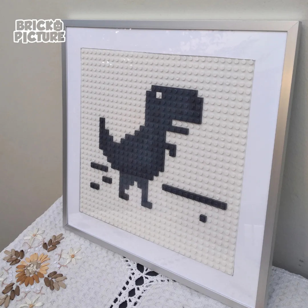 Cuadro Pixel Art Dinosaurio de Chrome – Diseño enmarcado de 200 piezas tipo Lego (32 cm)