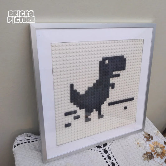 Cuadro Pixel Art Dinosaurio de Chrome – Diseño enmarcado de 200 piezas tipo Lego (32 cm)